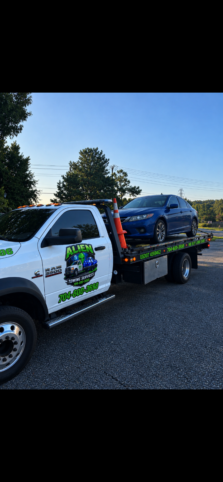 RAM 3500 towing blue car